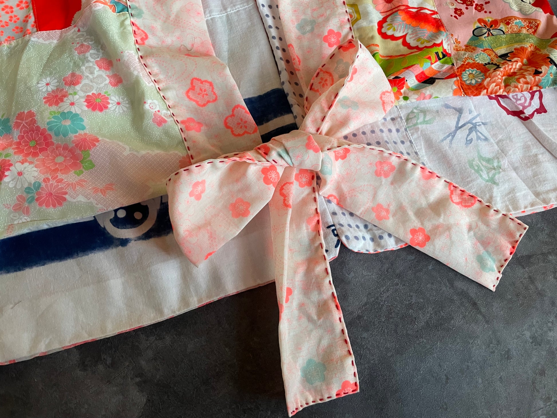 リボンの甘いガーリッシュなカーディガン